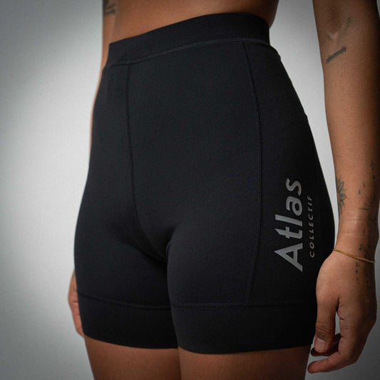 Illumi Trax WMNS Running Half Tights in black with reflective detailing and storage pockets.