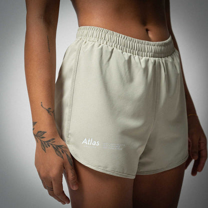 Women's beige 4" race shorts, Aeria Fortis, lightweight, breathable, with elastic waistband.
