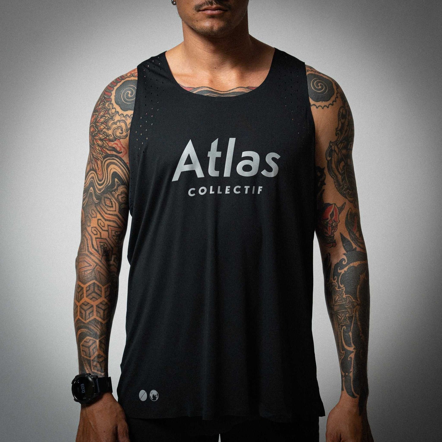 Illumi Trax Running Tank Black with reflective prints, ultra-lightweight and breathable fabric.