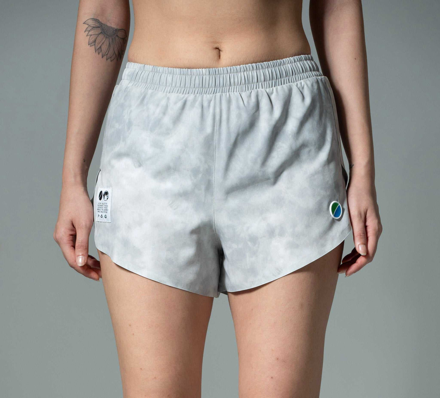 Women's V3 Core WMNS 3" grey tie-dye running shorts made from recycled polyester with gel compartments and zip pocket.