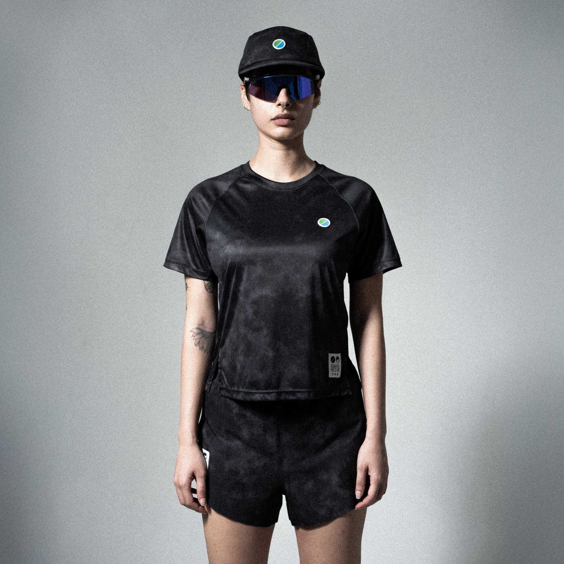 Eco-friendly V3 Core WMNS T-Shirt in black tie-dye with raglan sleeves, modeled by a person.