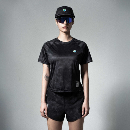 Eco-friendly V3 Core WMNS T-Shirt in black tie-dye with raglan sleeves, modeled by a person.